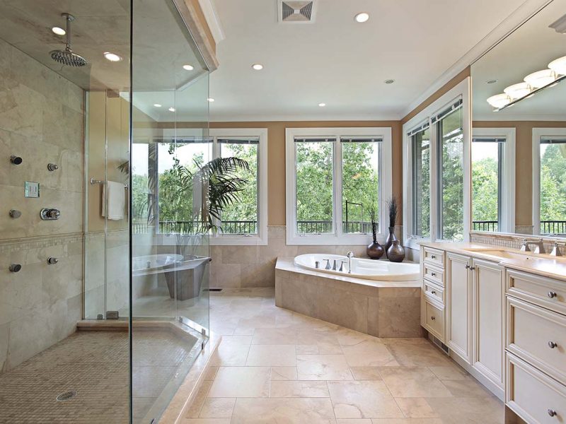 Master bath in new construction home with large glass shower